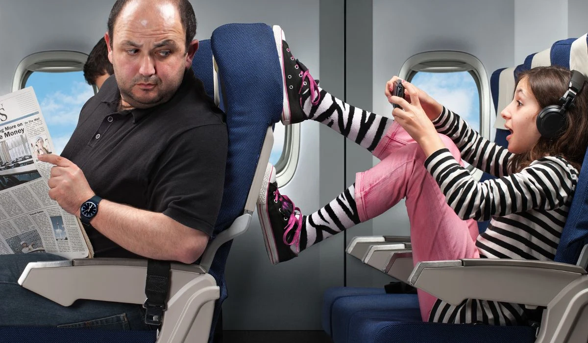 Putting feet on walls or other passengers’ seats